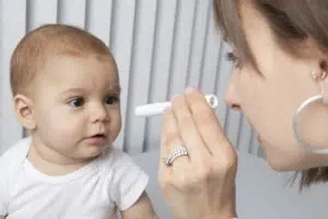 Doctor looking into a baby’s eye