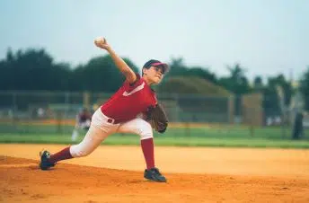 Little boy throwing a baseball