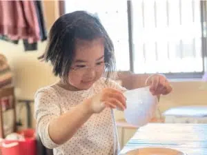 Little girl making a craft