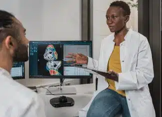 a man showing something on the computer
